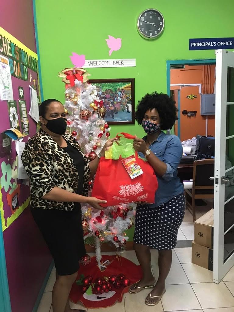 Two women sharing a community holiday gift